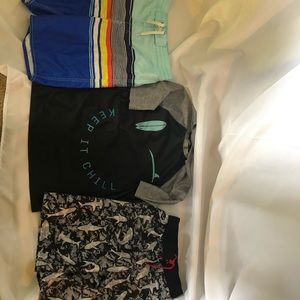 2 boys swim shorts and a sun shirt